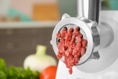 Meat grinder with fresh forcemeat clipart