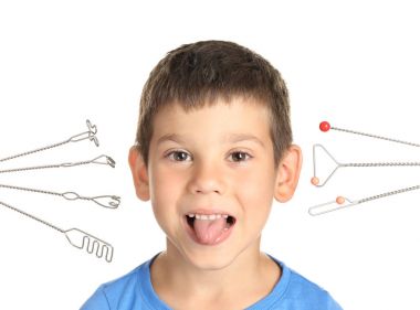 Cute boy and logopedic probes for speech correction on white background clipart