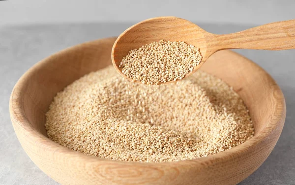 Spoon with quinoa seeds — Stock Photo, Image