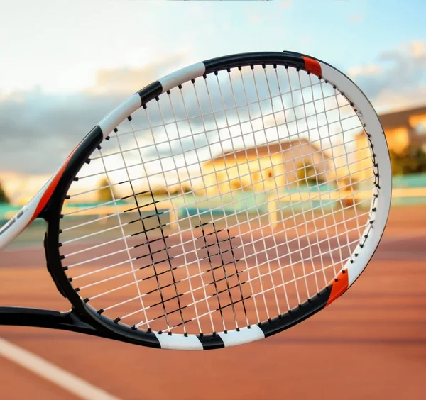 Tennis racket and court on background — Stock Photo, Image