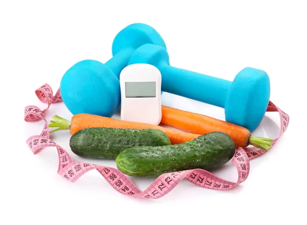 Composition with digital glucometer, fresh vegetables and dumbbells on white background. Diabetes concept — Stock Photo, Image