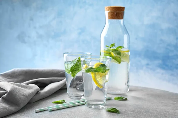 Basil water in glass ware on table — стоковое фото