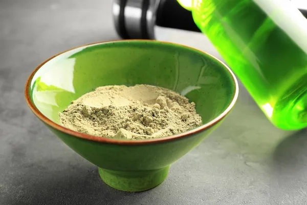 Bowl of hemp protein powder on table — Stock Photo, Image