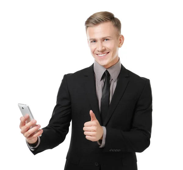 Jonge zakenman met telefoon op witte achtergrond — Stockfoto