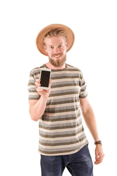 Jovem hipster homem segurando smartphone no fundo branco — Fotografia de Stock