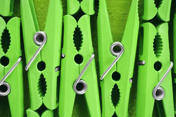 Green clothes pins, closeup