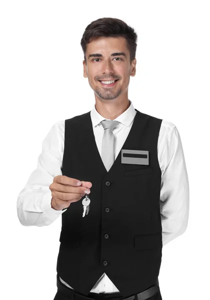 Mannelijke receptioniste met sleutel van hotelkamer op witte achtergrond — Stockfoto