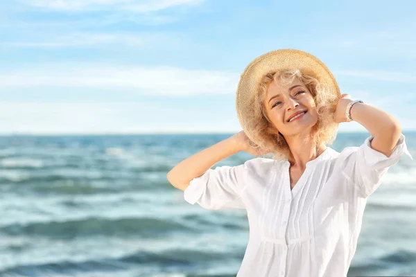 Happy senior woman at sea — Stock Photo, Image