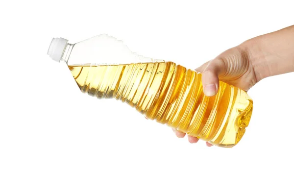 Hand holding bottle with cooking oil — Stock Photo, Image