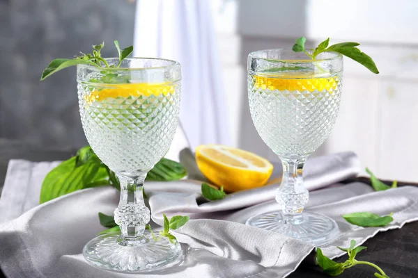 Glasses with basil water on table — Stock Photo, Image