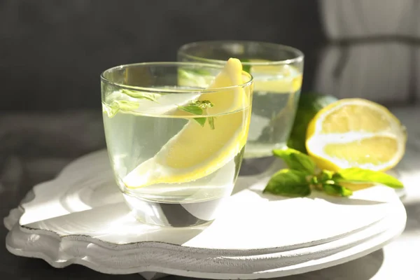 Board with glasses of basil water on table — Stock Photo, Image