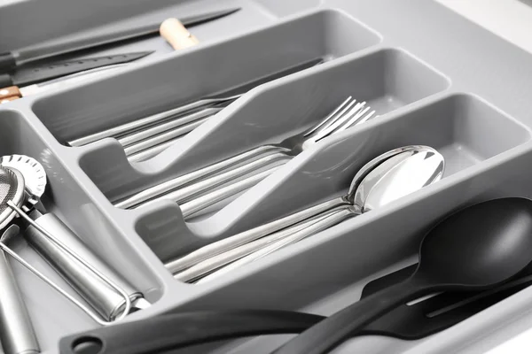 Kitchen utensils in drawer, closeup — Stock Photo, Image