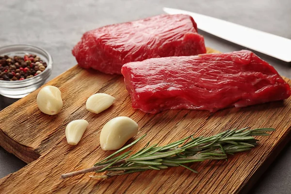 Two raw steaks with rosemary — Stock Photo, Image
