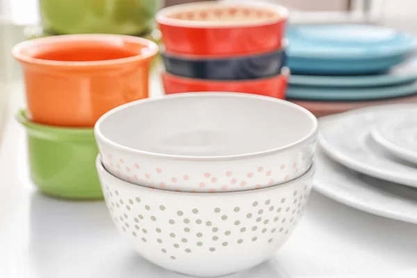 Composition with bowls and tableware on white background — Stock Photo, Image