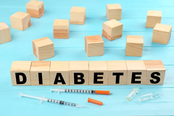 Composition with syringes and word Diabetes — Stock Photo, Image