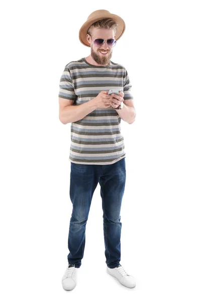 Young hipster man using smartphone on white background — Stock Photo, Image