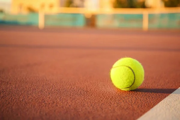 Tennis ball on modern court — Stock Photo, Image