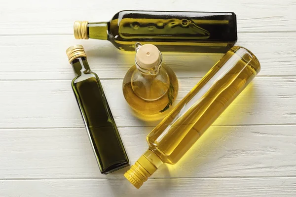 Bottles with different cooking oil — Stock Photo, Image