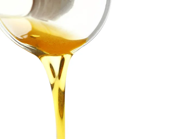 Pouring cooking oil on white background, closeup — Stock Image Pouring cooking oil — Stock Photo, Image