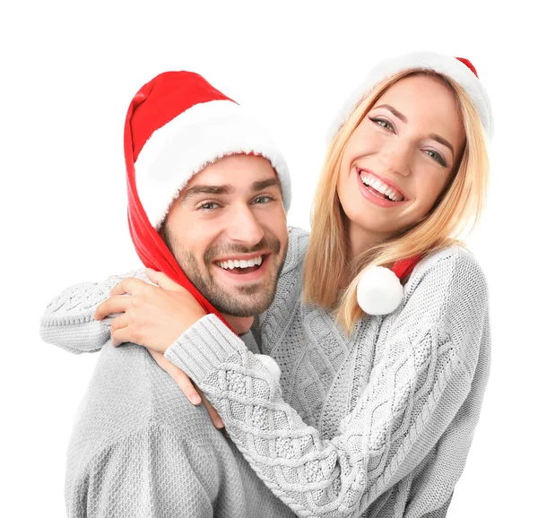 サンタ帽子で若いカップル — ストック写真