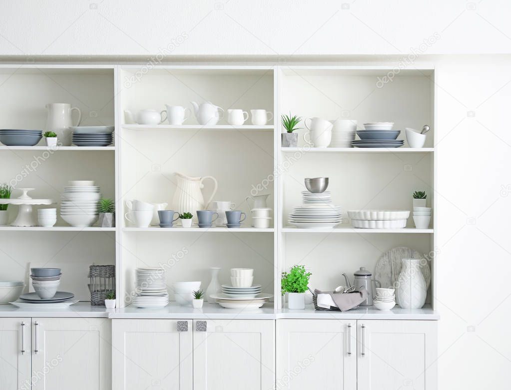 White storage stand with ceramic dishware