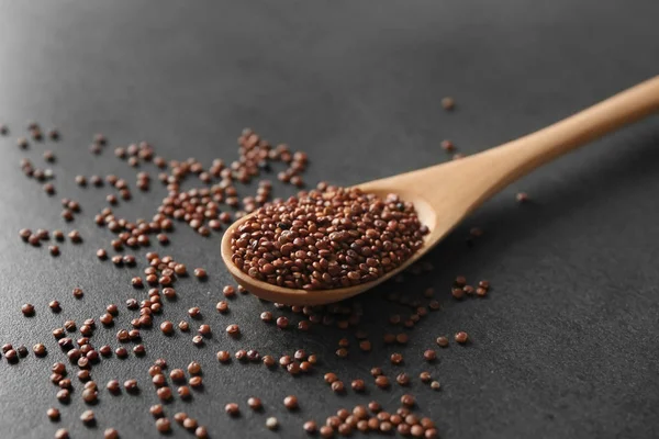 Spoon with quinoa seeds — Stock Photo, Image