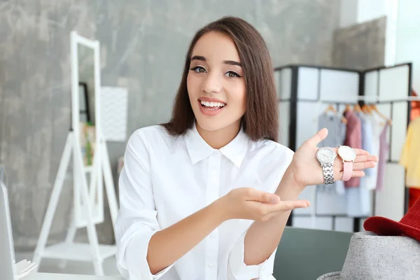 Young female blogger with watches at home — Stock Photo, Image