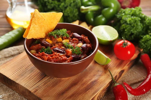 Chili con carne in bowl served with chips — Stock Photo, Image