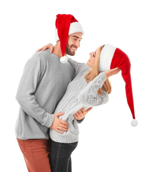 Jeune couple dans chapeaux de Père Noël — Photo