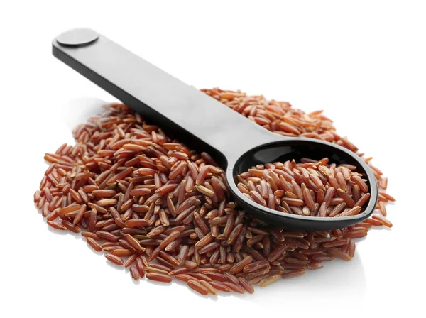 Measuring spoon and heap of red Cargo rice — Stock Photo, Image