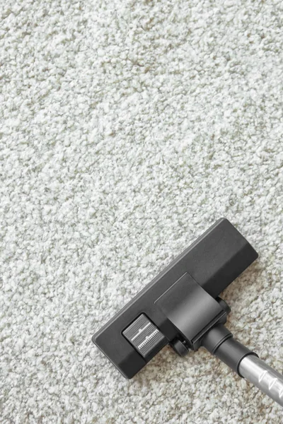 Vacuum cleaner on carpet — Stock Photo, Image