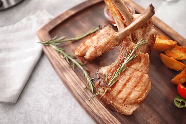 Delicious ribs served with rosemary — Stock Photo, Image