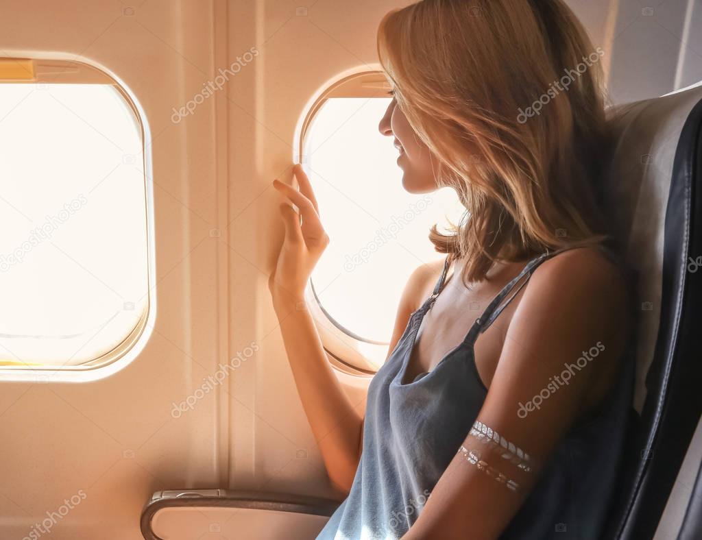 Young woman in airplane