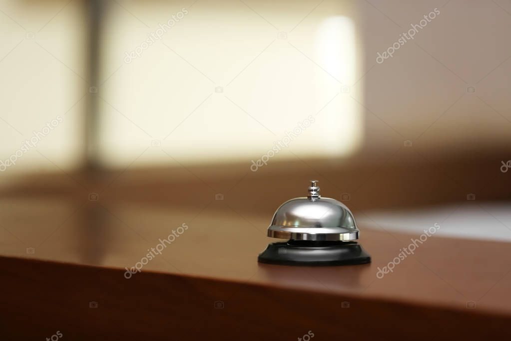 Service bell on reception desk in hotel