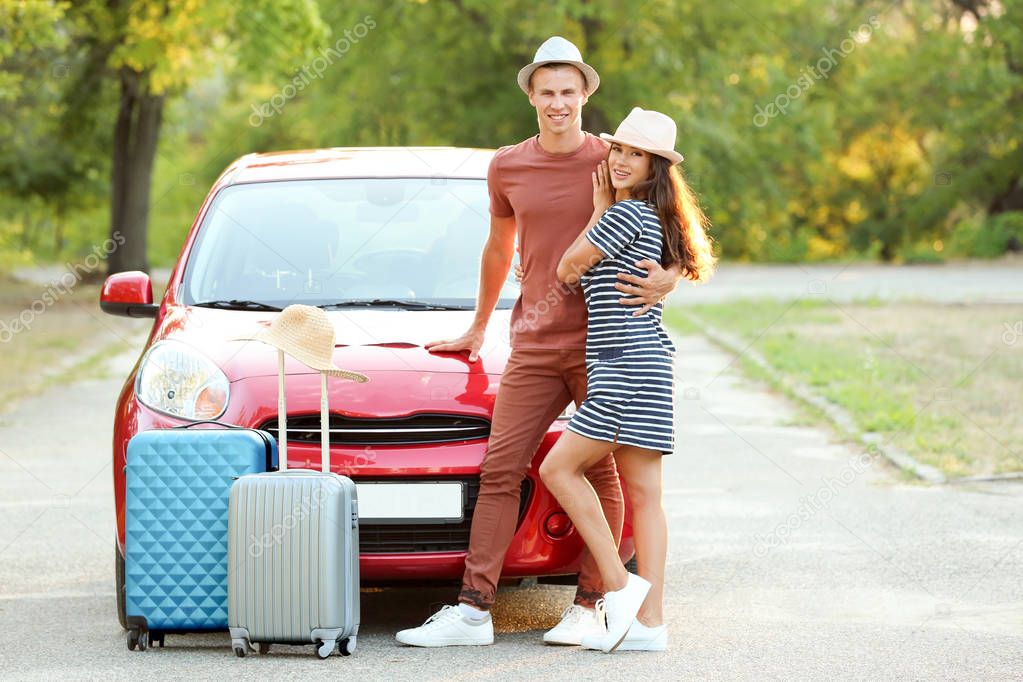 Happy couple near car