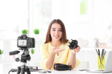 female blogger recording video clipart