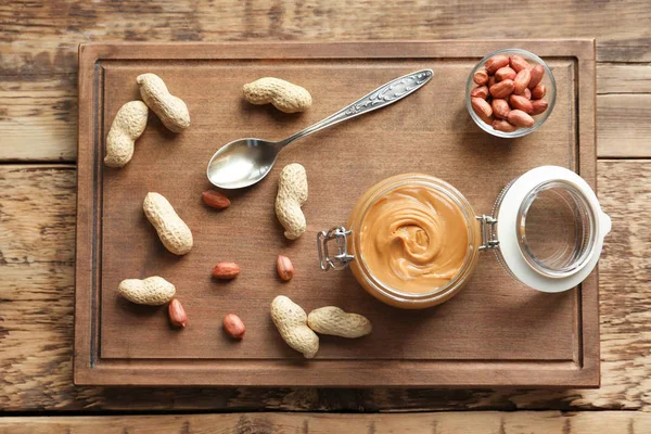 Composition with creamy peanut butter — Stock Photo, Image