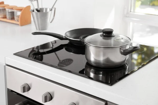 Electric stove with utensils in kitchen