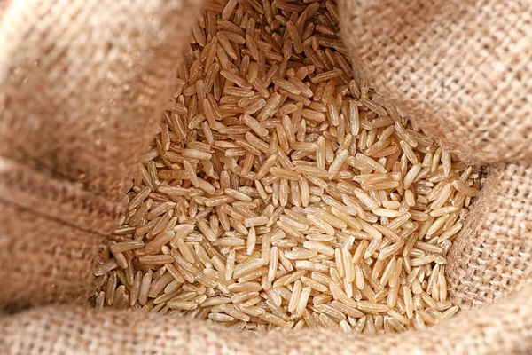Bag with brown rice — Stock Photo, Image