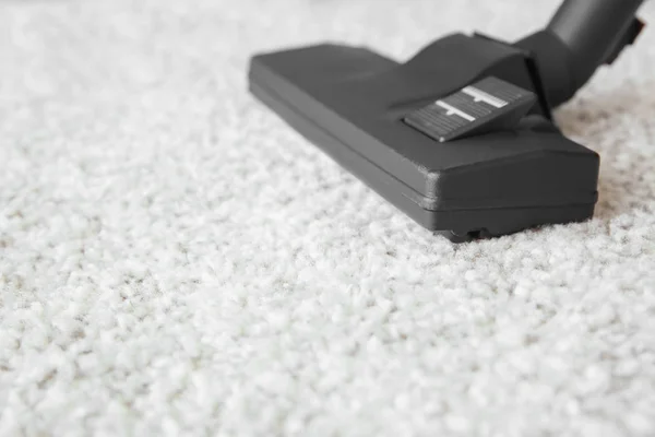 Vacuum cleaner on carpet — Stock Photo, Image