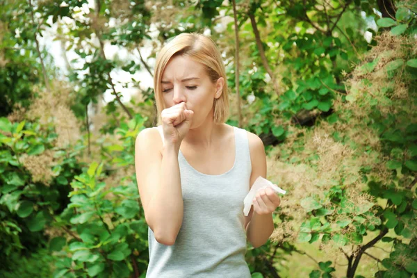 Young woman with allergy outdoors — Stock Photo, Image