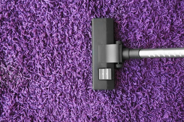 Vacuum cleaner on carpet — Stock Photo, Image