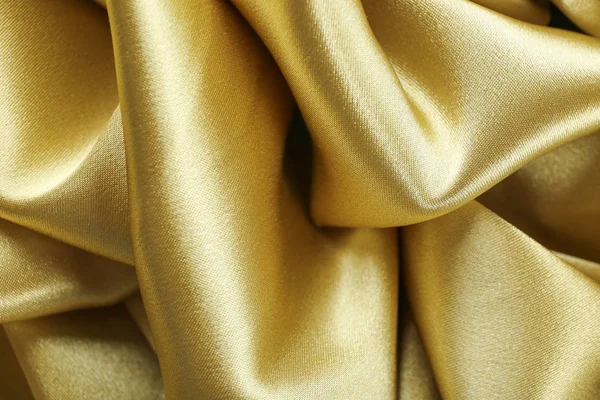 Zlaté hedvábné textury, zblizka — Stock fotografie