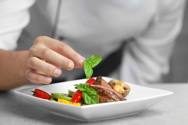 Chef decorating tasty juicy meat — Stock Photo, Image