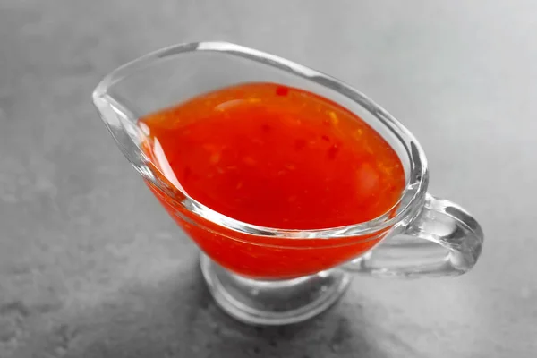 Chili sauce in gravy boat — Stock Photo, Image