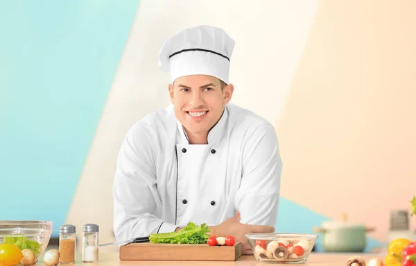Young male chef in kitchen — Stock Photo, Image