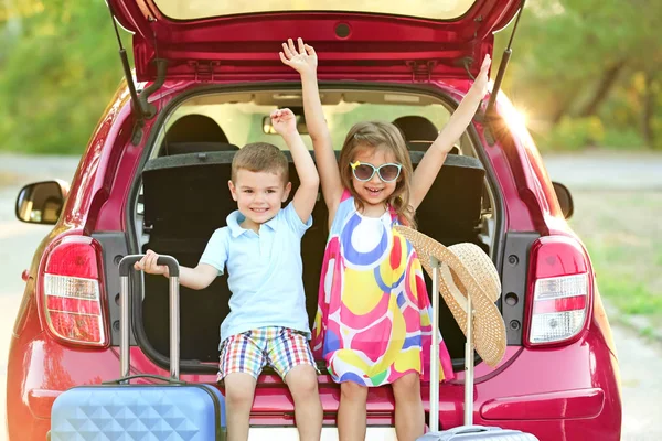 Children sitting in car — Stock Photo, Image