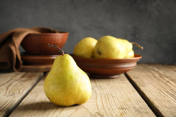 Ripe yellow pear on wooden table — Stock Photo, Image