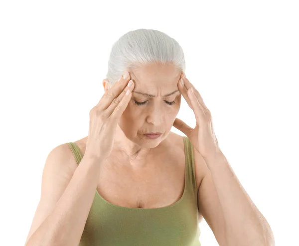 Elderly woman suffering from headache on white background — Stock Photo, Image