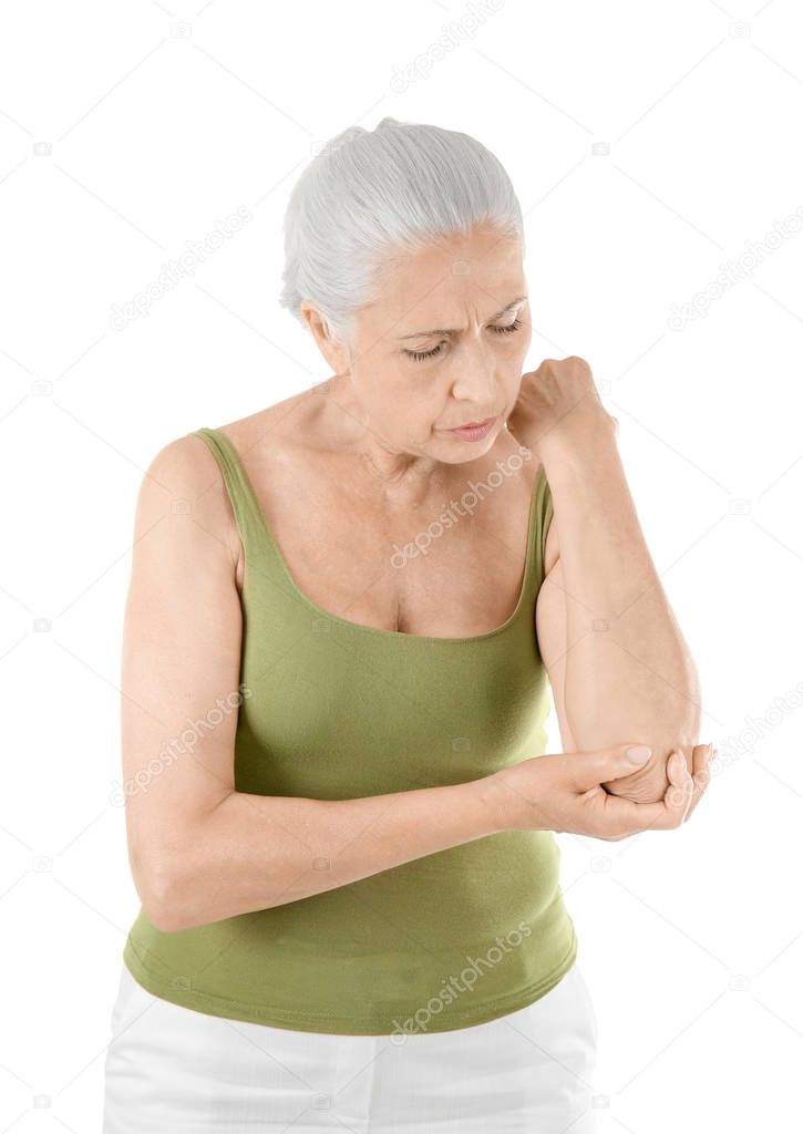 Elderly woman suffering from pain in elbow on white background